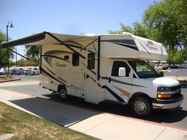 The Coachmen Freelander 21-RS is parked on the road, showcasing its compact and versatile design